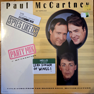 Sealed 12" single for Paul McCartney's "Spies Like Us", a song with which he seems to have a complicated history, as it has rarely been on CD and never in hits collections.  I am also conflicted, having loved the song as a kid, but am now more in agreement with John Landis, director of the movie this was for, that it is crap. Bought from Fountain Records.